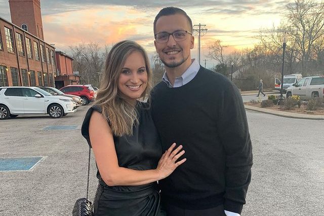 Derek Carr standing with her girlfriend